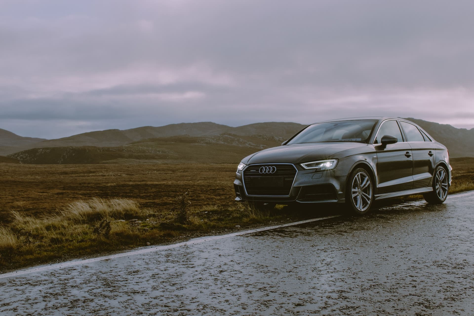 black-audi-parked-on-roadside